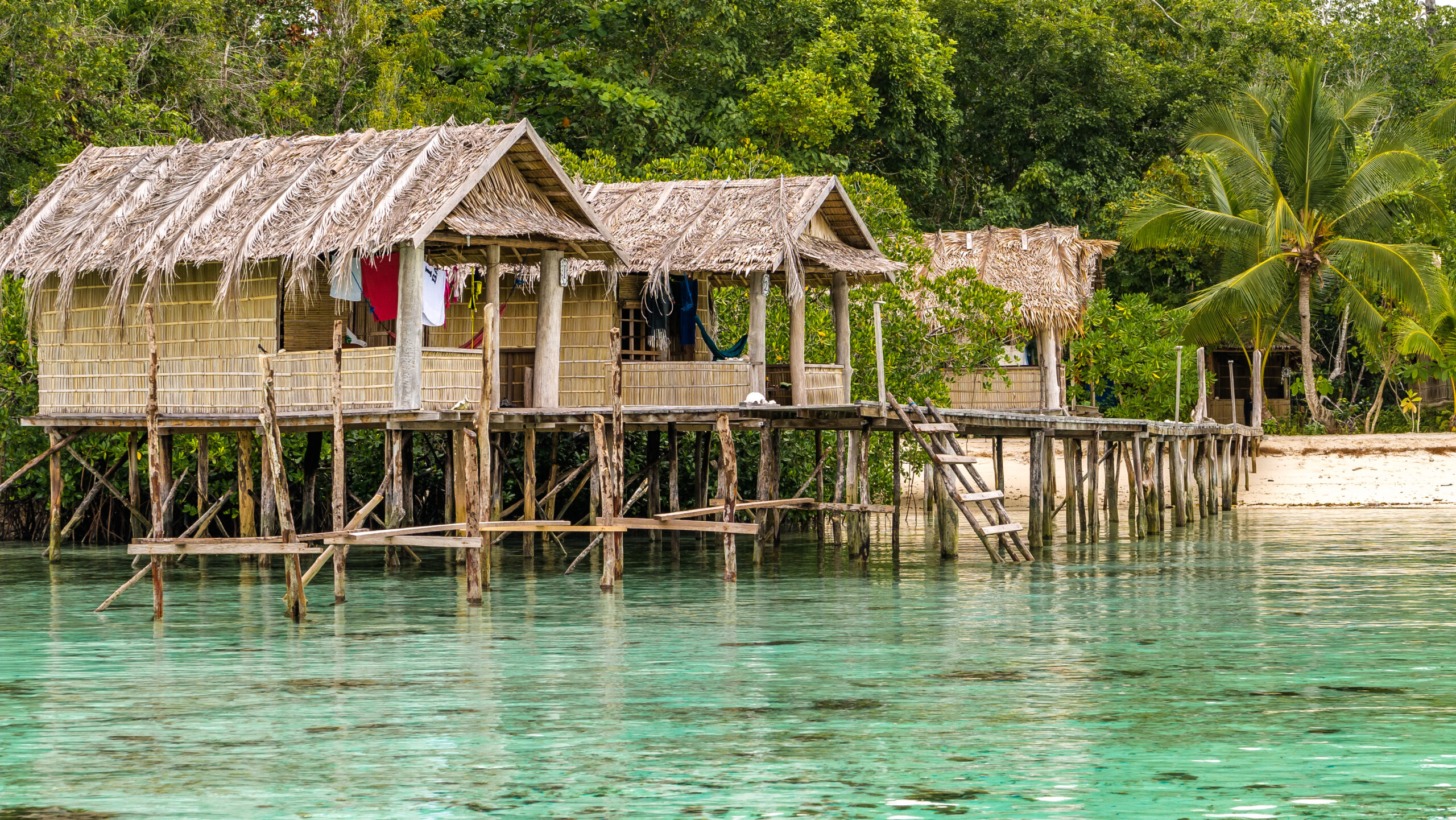 Bamboo Huts on wooden Stocks of an Homestay, Gam Island, West Papuan, Raja Ampat. Indonesia