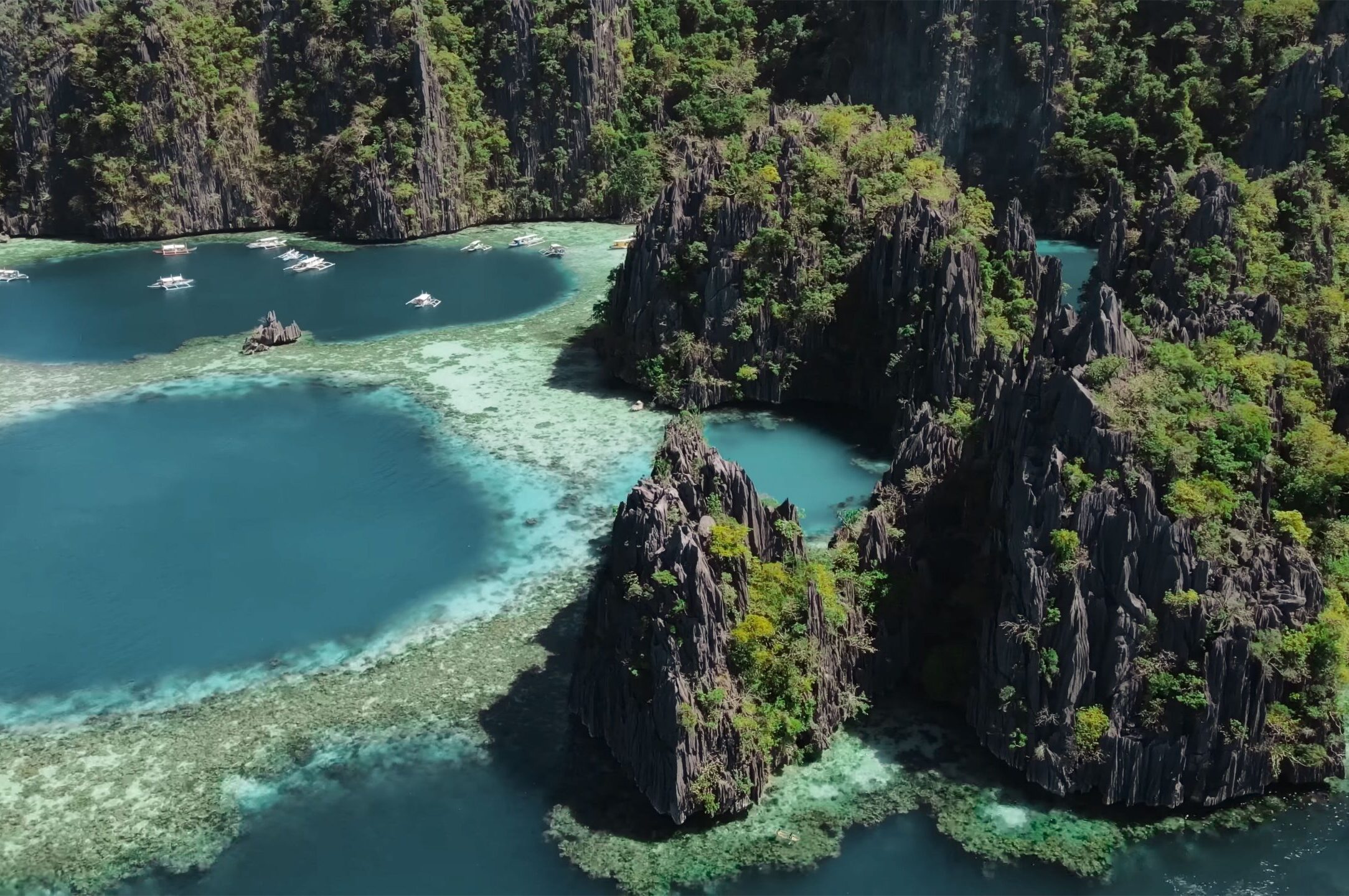 A majestic mountain landscape, featuring a clear blue body of water